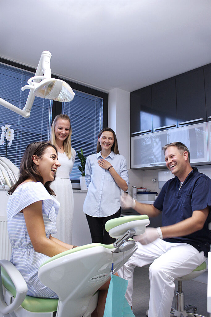 Dr. Danny Goljak treating patient with a friendly smile