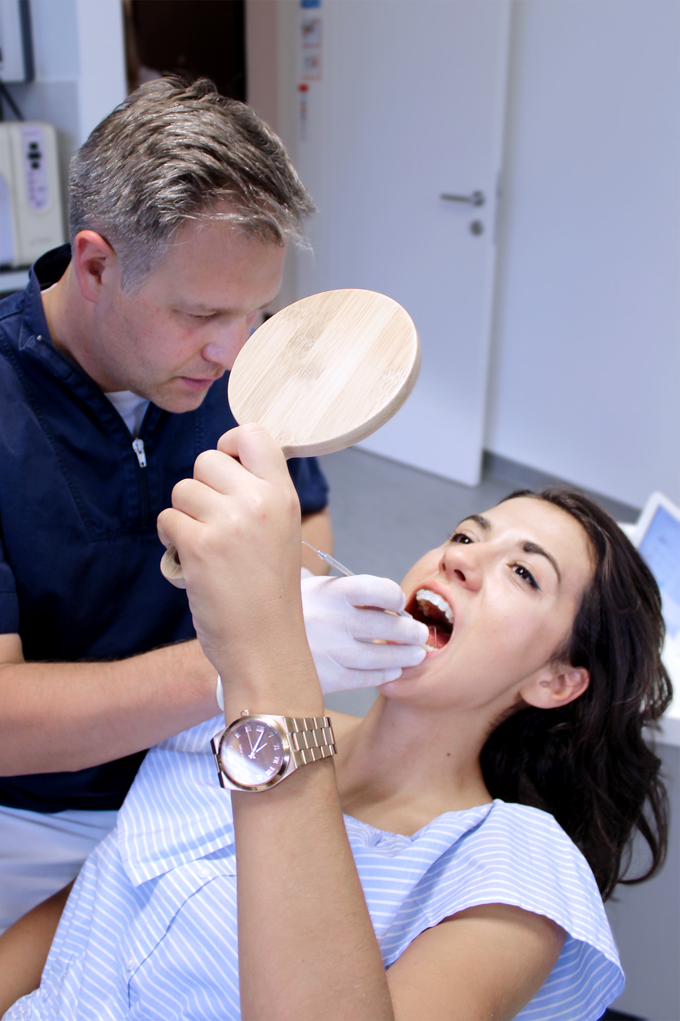 Dr. Danny Goljak treating patient with a friendly smile